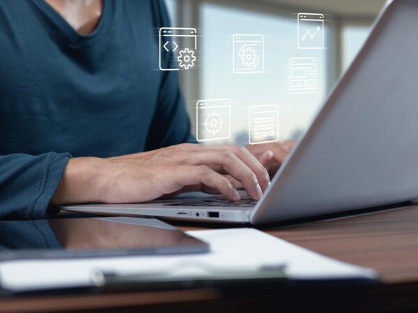 Modern business website displayed on laptop and mobile devices in a professional workspace