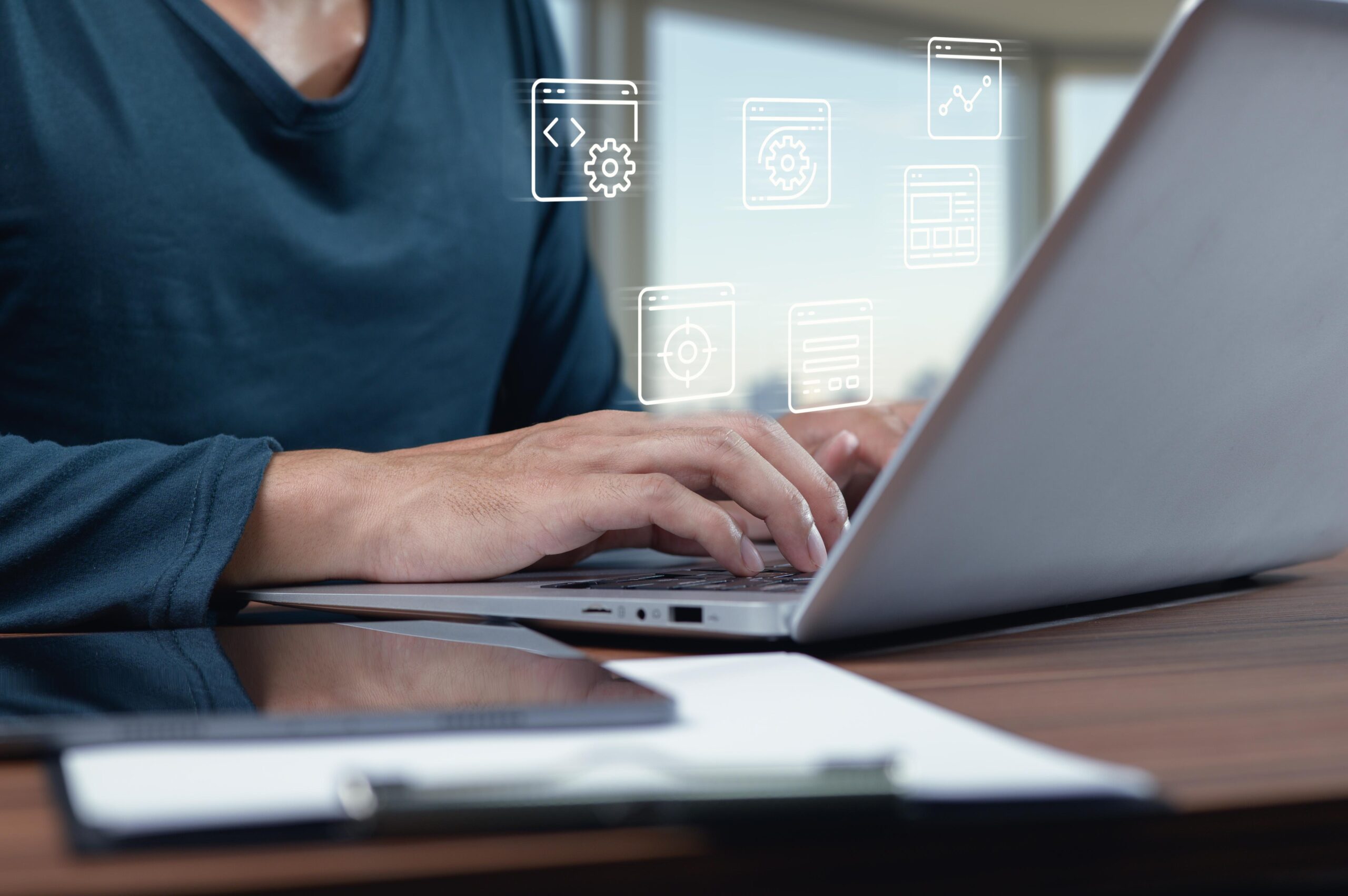 Modern business website displayed on laptop and mobile devices in a professional workspace