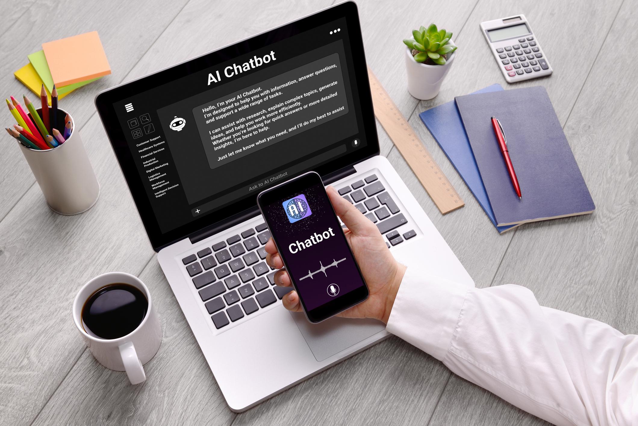Professional employee using AI chatbot technology on a laptop in a modern office workspace